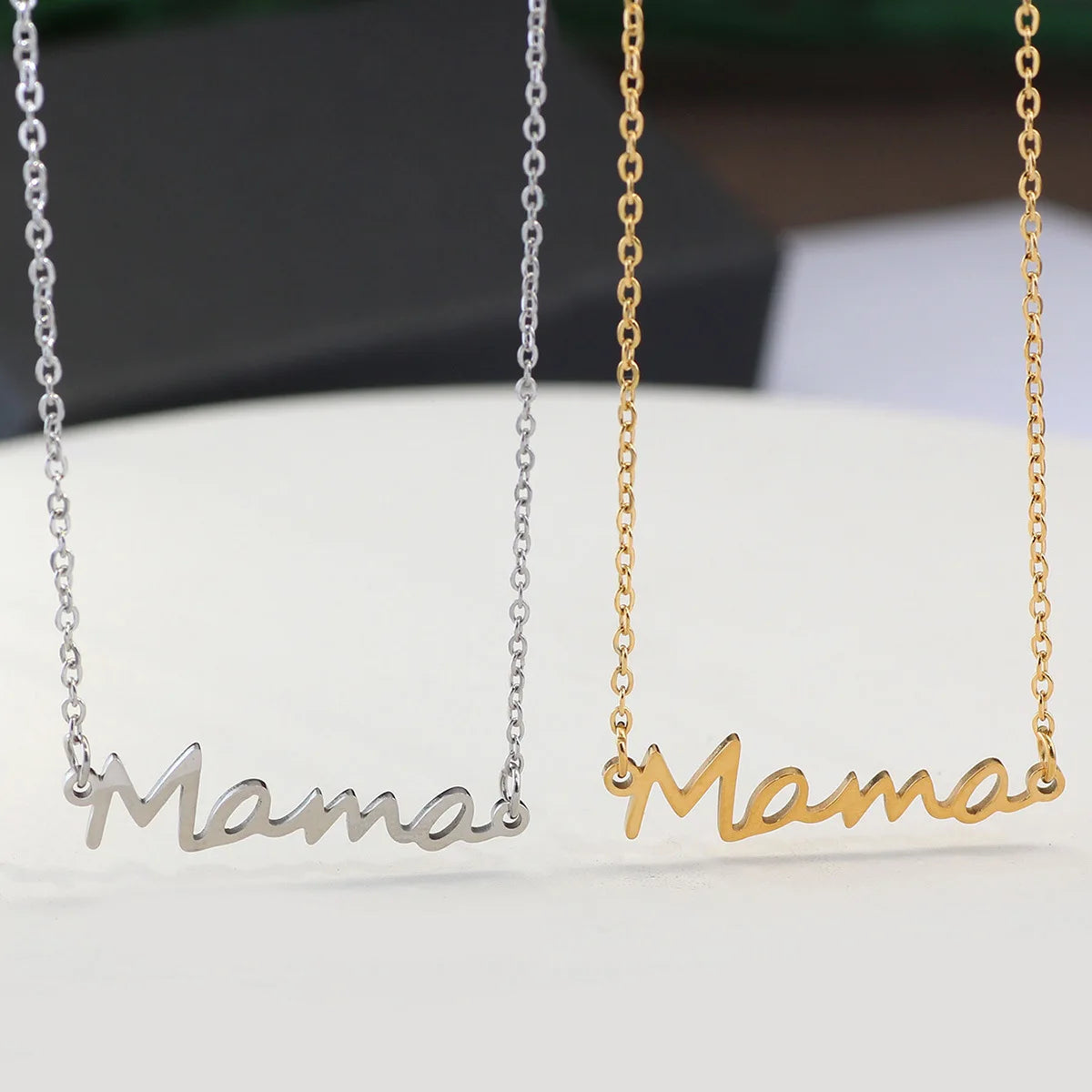 Celebrate Mom with our "Mama" Titanium Steel Necklace in a luxurious Pink Rose Bear Gift Box. A loving gift for Mother's Day 2024.