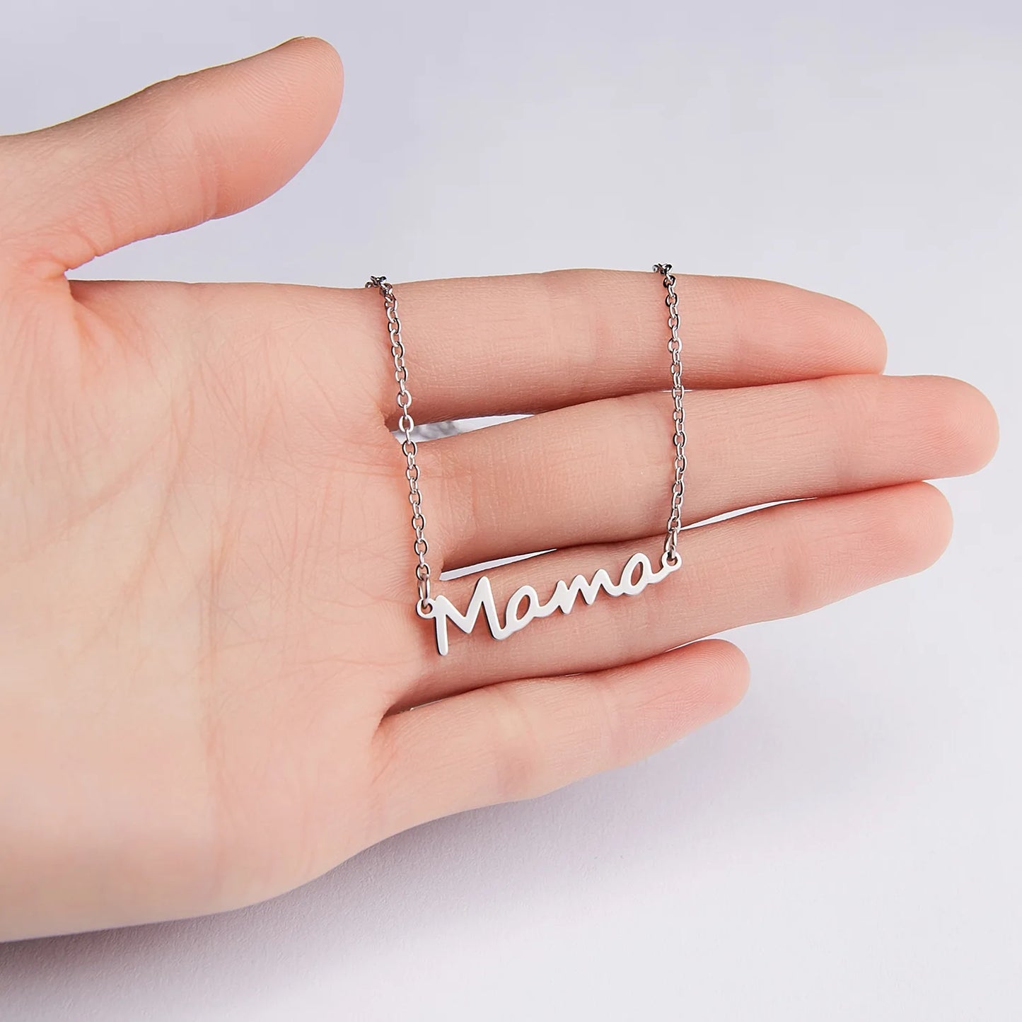 Celebrate Mom with our "Mama" Titanium Steel Necklace in a luxurious Pink Rose Bear Gift Box. A loving gift for Mother's Day 2024.