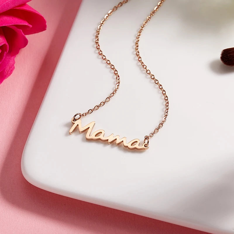 Celebrate Mom with our "Mama" Titanium Steel Necklace in a luxurious Pink Rose Bear Gift Box.  A loving gift for Mother's Day 2024.