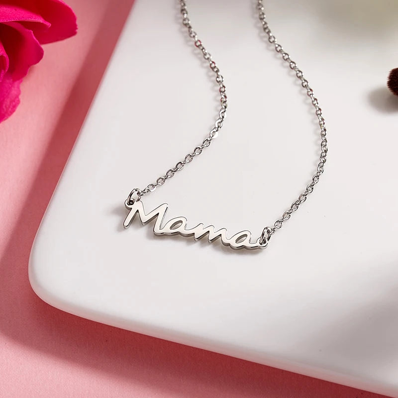 Celebrate Mom with our "Mama" Titanium Steel Necklace in a luxurious Pink Rose Bear Gift Box.  A loving gift for Mother's Day 2024.